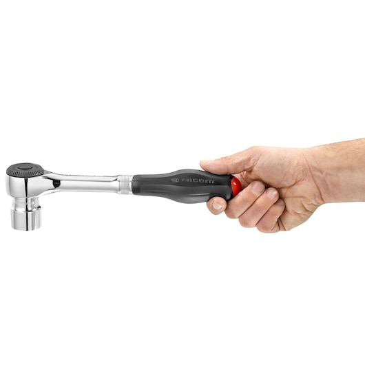 Facom S_360 ratchet wrench with black handle and socket, held in a hand, side view.