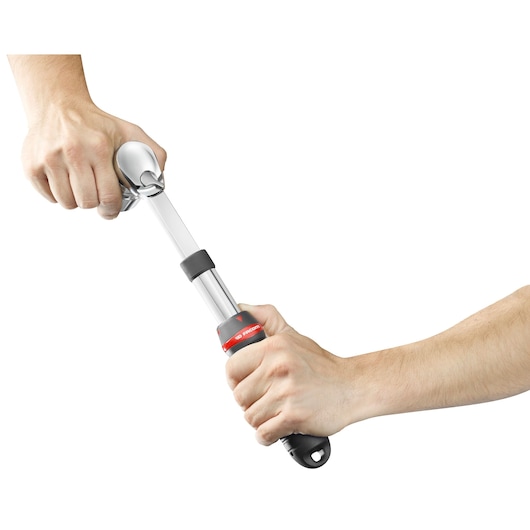 Photo of Facom SXL_161 extendable ratchet wrench held in hands on white background.
