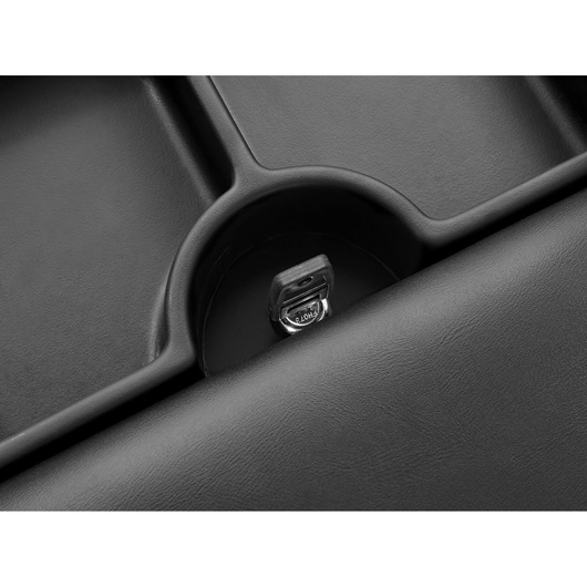 Facom TCS-P1 lockable compartment key inserted in black textured tray, top-down angle.