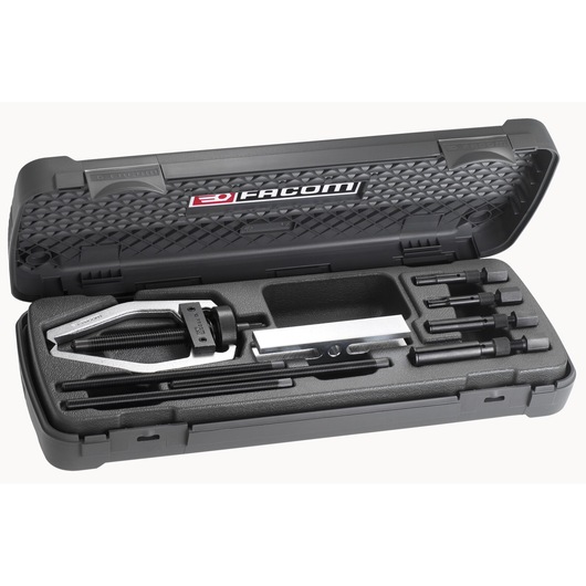 Facom U_301BJ1 bearing puller set in black hard case, top angle, with multiple components visible.