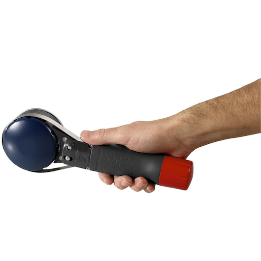 Photo of Facom U_46ACL oil filter wrench with black handle, red end, and blue metal clamp, held in a hand, side view.