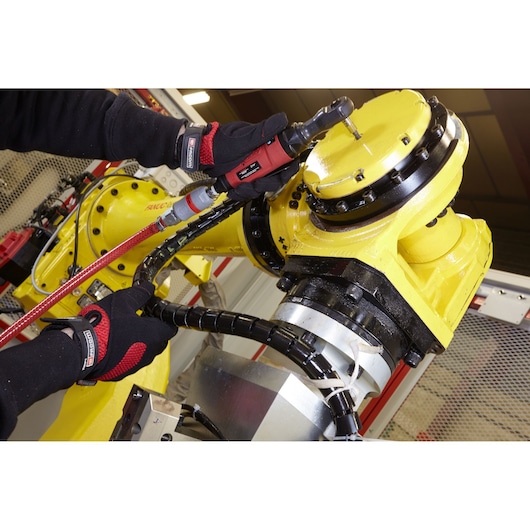Photo of Facom VR_R227 pneumatic tool used on a yellow industrial robotic arm, close-up angle.