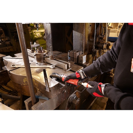 Facom VR.S3136PB ratchet tool used on industrial machinery, worker wearing gloves.
