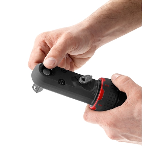 Photo of Facom VR_SJ3500PB ratchet tool being adjusted by hand, black and red body, white background.