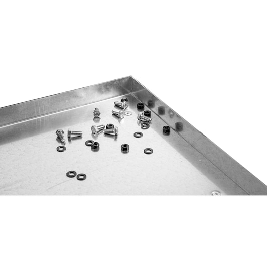 Facom WB2.2000GS steel tray with scattered bolts, nuts, and washers, top angle on white background.